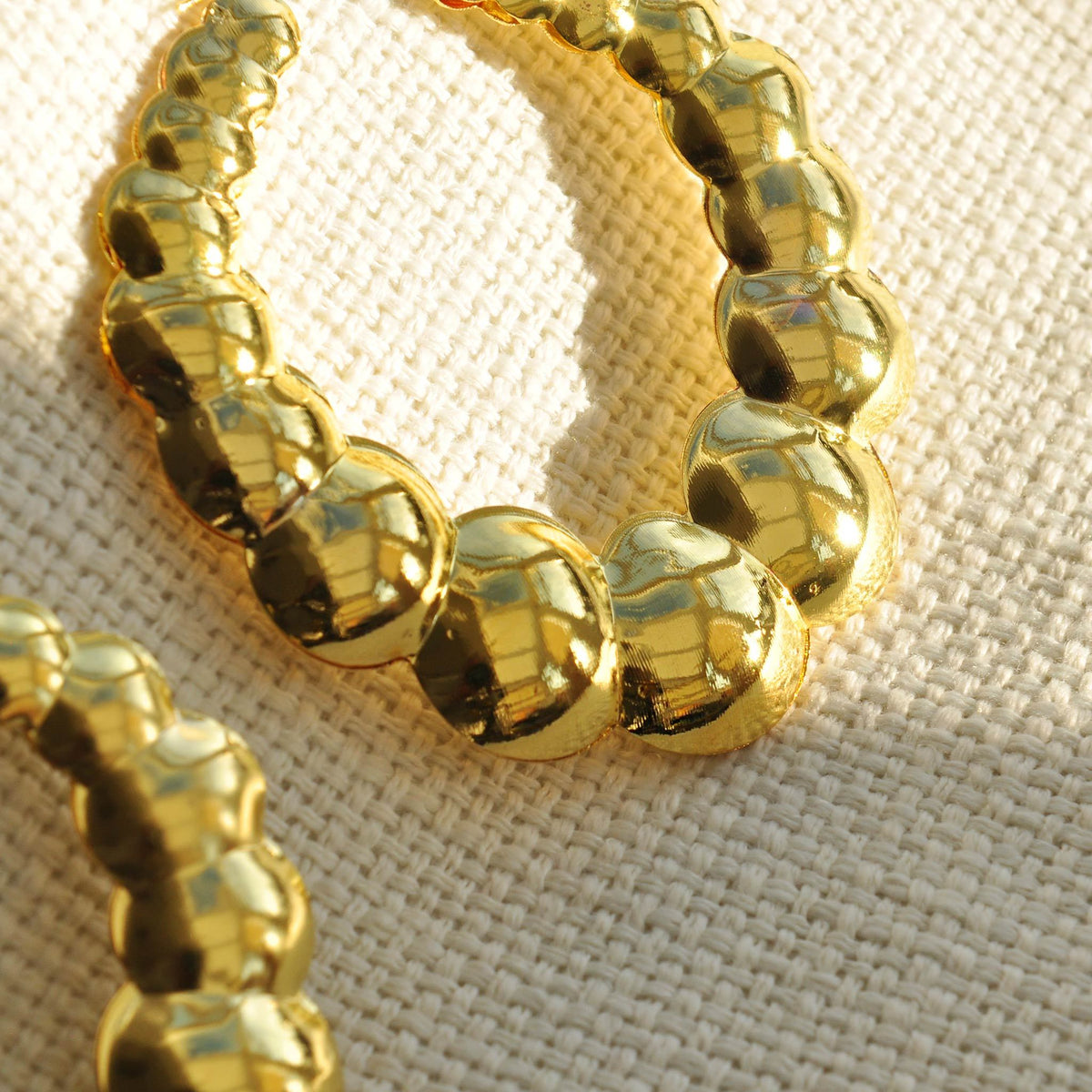 Gold statement earrings bubble