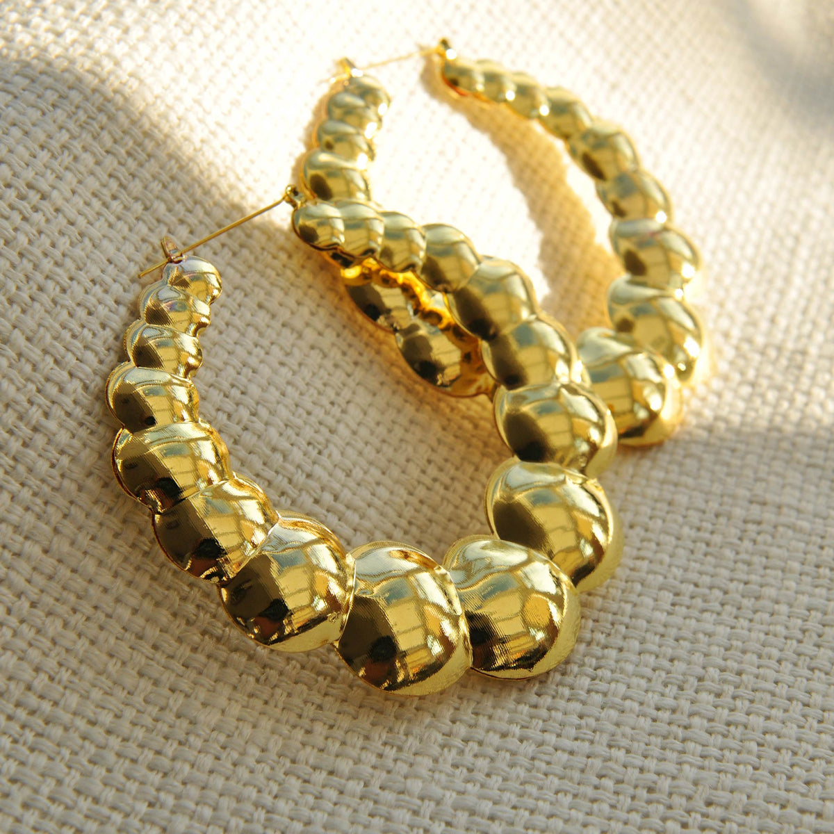 Gold statement earrings bubble