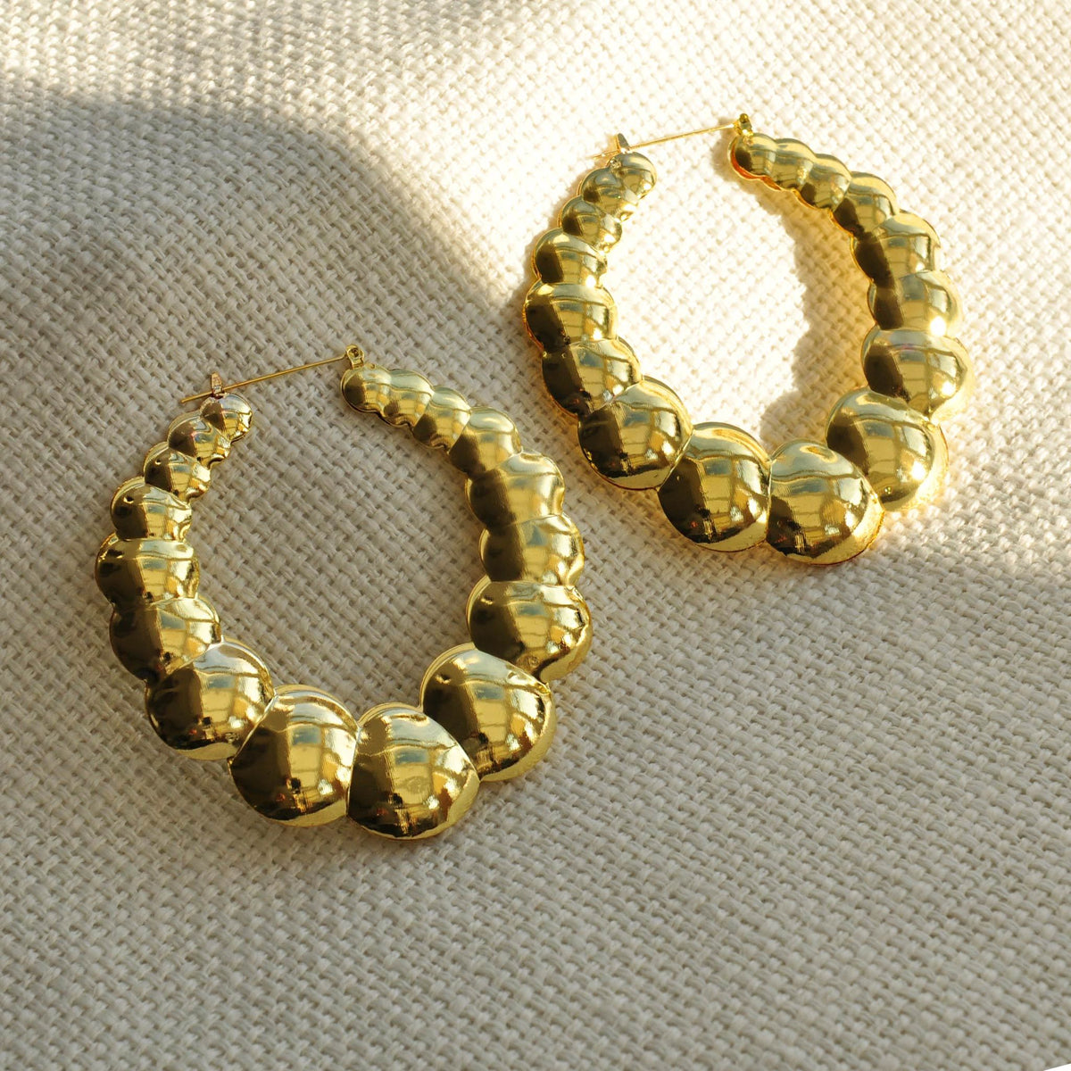 Gold statement earrings bubble